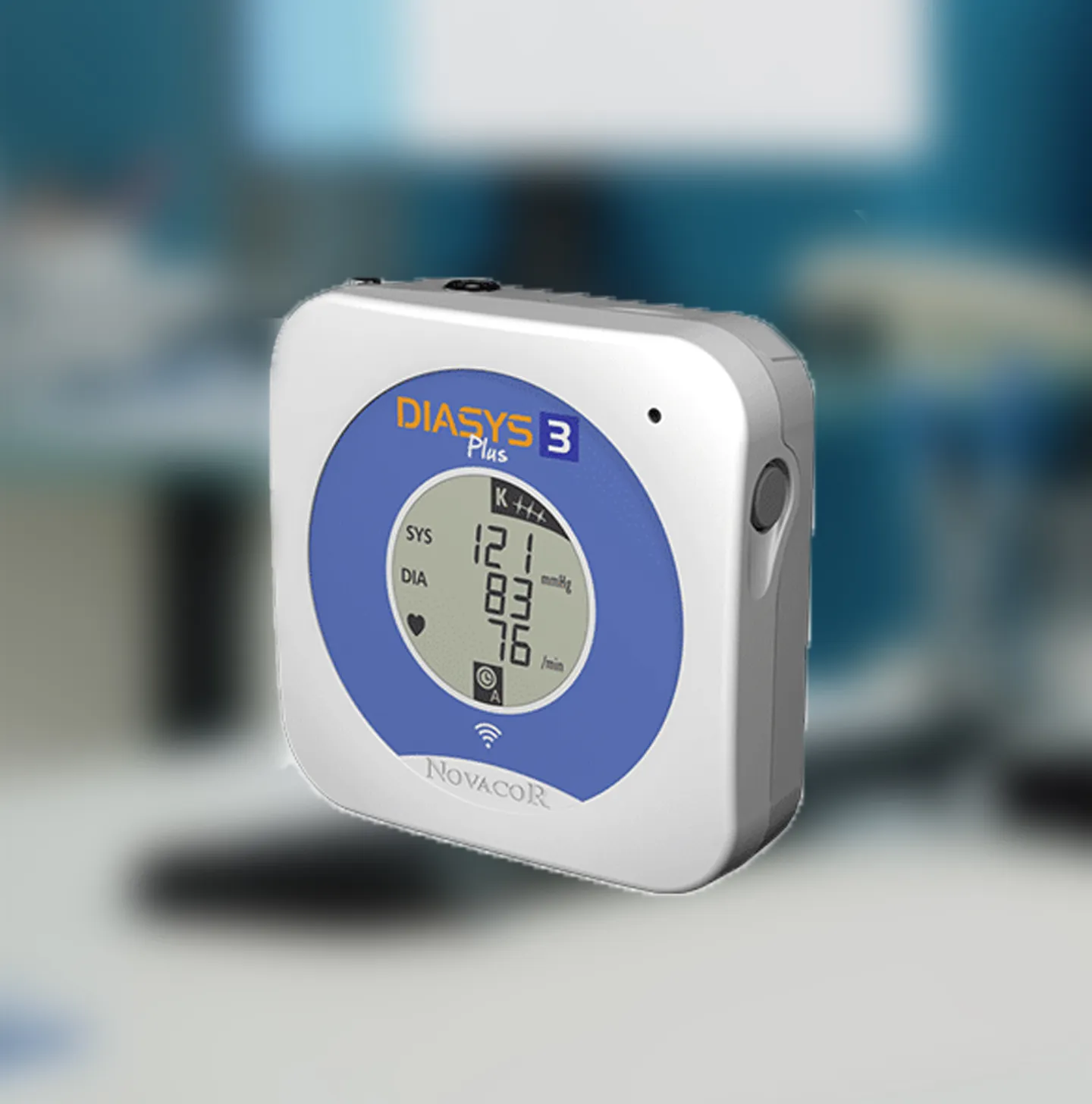 Portable blood pressure monitor displaying systolic 121, diastolic 83, and pulse 76 in a medical setting.